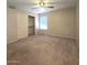 Well-lit bedroom with ceiling fan and closet at 12419 W Monte Vista Rd, Avondale, AZ 85392