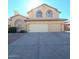 Two-story house with three-car garage and a large driveway at 12419 W Monte Vista Rd, Avondale, AZ 85392