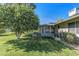 Backyard with screened patio and two large orange trees at 12539 W Shadow Hills Dr, Sun City West, AZ 85375