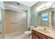 Clean bathroom with shower and vanity with wooden cabinets at 12539 W Shadow Hills Dr, Sun City West, AZ 85375