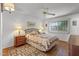 Cozy bedroom with wooden furniture and laminated flooring at 12539 W Shadow Hills Dr, Sun City West, AZ 85375