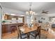 Bright dining room with hardwood floors and kitchen access at 12539 W Shadow Hills Dr, Sun City West, AZ 85375