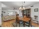 Spacious dining area with hardwood floors and view of living room at 12539 W Shadow Hills Dr, Sun City West, AZ 85375