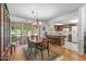 Open concept dining area with kitchen access and view to backyard at 12539 W Shadow Hills Dr, Sun City West, AZ 85375