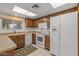 Kitchen with white appliances and wood cabinets at 12539 W Shadow Hills Dr, Sun City West, AZ 85375