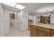 Galley kitchen with white appliances and wood cabinets at 12539 W Shadow Hills Dr, Sun City West, AZ 85375