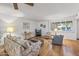 Living room with hardwood floors, comfortable seating, and a view at 12539 W Shadow Hills Dr, Sun City West, AZ 85375