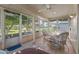 Bright sunroom with wicker furniture and view of the backyard at 12539 W Shadow Hills Dr, Sun City West, AZ 85375