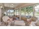 Relaxing sunroom with wicker furniture and large windows at 12539 W Shadow Hills Dr, Sun City West, AZ 85375