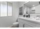 Clean bathroom with white vanity, quartz countertop, and modern fixtures at 13614 N Hawthorn Dr, Sun City, AZ 85351