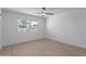 Simple bedroom with light walls and ceiling fan at 13614 N Hawthorn Dr, Sun City, AZ 85351