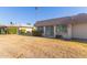 Back exterior view of the house with sliding glass doors to the backyard at 13614 N Hawthorn Dr, Sun City, AZ 85351