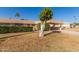 Front view of a Ranch style home with carport and mature landscaping at 13614 N Hawthorn Dr, Sun City, AZ 85351