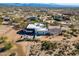 Aerial view of a large home with a covered patio and desert landscape at 13648 E Aloe Vera Dr, Scottsdale, AZ 85262