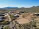 Aerial view of a large estate with desert landscape in the background at 13648 E Aloe Vera Dr, Scottsdale, AZ 85262