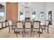 Elegant dining room features a large table with seating for eight at 13648 E Aloe Vera Dr, Scottsdale, AZ 85262