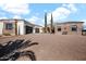 Wide view of the home's exterior, showcasing its stonework and architectural details at 13648 E Aloe Vera Dr, Scottsdale, AZ 85262