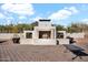 Outdoor fireplace with a modern design and ample wood storage at 13648 E Aloe Vera Dr, Scottsdale, AZ 85262