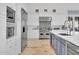 Modern kitchen with large island, stainless steel appliances and blue accents at 13648 E Aloe Vera Dr, Scottsdale, AZ 85262