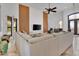 Open living room featuring a sectional sofa and wood accent wall at 13648 E Aloe Vera Dr, Scottsdale, AZ 85262