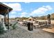 Outdoor kitchen with a grill, pizza oven, and seating area at 13648 E Aloe Vera Dr, Scottsdale, AZ 85262