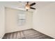 Bright bedroom with carpeted floors and window blinds at 14238 W Bronco Trl, Surprise, AZ 85387