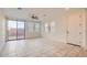 Dining area with tile floors, sliding door to patio, and window blinds at 14238 W Bronco Trl, Surprise, AZ 85387