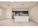 Modern kitchen with island and stainless steel appliances at 14238 W Bronco Trl, Surprise, AZ 85387