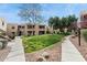 Two-story condo building with grassy courtyard and walkways at 14645 N Fountain Hills Blvd # 217, Fountain Hills, AZ 85268