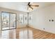 Living room with laminate floors, sliding glass door, and ceiling fan at 14645 N Fountain Hills Blvd # 217, Fountain Hills, AZ 85268