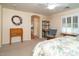 Main bedroom with a sitting area and access to the bathroom at 16549 W Desert Ln, Surprise, AZ 85388