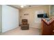 Bedroom with recliner, large closet and TV at 16549 W Desert Ln, Surprise, AZ 85388