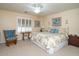 Spacious bedroom with a king-size bed and ample natural light at 16549 W Desert Ln, Surprise, AZ 85388