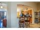 Kitchen breakfast bar with two chairs and view into living area at 16549 W Desert Ln, Surprise, AZ 85388