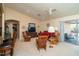 Living room with open floor plan, showcasing a view of the kitchen and access to a patio at 16549 W Desert Ln, Surprise, AZ 85388