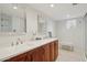 Elegant bathroom with double vanity, large mirrors, and a walk-in shower at 16837 E Lunar Ln, Fountain Hills, AZ 85268