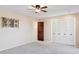 Spacious bedroom with double doors and built-in closet at 16837 E Lunar Ln, Fountain Hills, AZ 85268