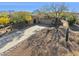 Single-story home with a long driveway, desert landscaping, and mountain views at 16837 E Lunar Ln, Fountain Hills, AZ 85268