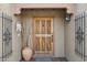 Ornate wooden front door with decorative details at 16837 E Lunar Ln, Fountain Hills, AZ 85268