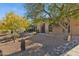 Landscaped front yard with mature trees and gravel at 16837 E Lunar Ln, Fountain Hills, AZ 85268