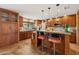 Island kitchen with wood cabinets and granite countertops at 16837 E Lunar Ln, Fountain Hills, AZ 85268