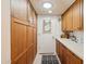 Laundry room with built-in cabinets and storage at 16837 E Lunar Ln, Fountain Hills, AZ 85268