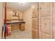 Bright laundry room with built-in cabinets and workspace at 16837 E Lunar Ln, Fountain Hills, AZ 85268