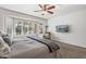 Spacious bedroom with a king-size bed and bay window at 16935 W Villagio Dr, Surprise, AZ 85387