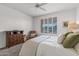 Serene bedroom with a queen bed and window with shutters at 16935 W Villagio Dr, Surprise, AZ 85387