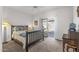 Cozy bedroom with patio access and built-in desk at 16935 W Villagio Dr, Surprise, AZ 85387