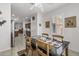 Bright dining area with wood table and chairs, near kitchen at 16935 W Villagio Dr, Surprise, AZ 85387