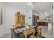 Bright dining area with wood table and chairs, near kitchen at 16935 W Villagio Dr, Surprise, AZ 85387