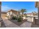 Side yard with gate and desert landscaping at 16935 W Villagio Dr, Surprise, AZ 85387