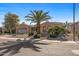 Single-story home with desert landscaping and a two-car garage at 16935 W Villagio Dr, Surprise, AZ 85387